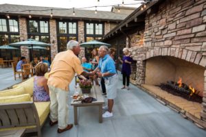 People gathering at wine tasting event