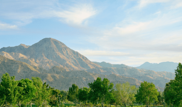 View of Indian Wells Golf Course including mountains and trees in the background